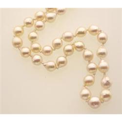 CULTURED PEARL NECKLACE A single strand of sixty-four baroque cultured pearls measuring 6.3-7.3 m...