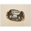 Image 1 : vintage aquamarine and gold ring The unusual 10K yellow gold bark textured mount reveals a square...