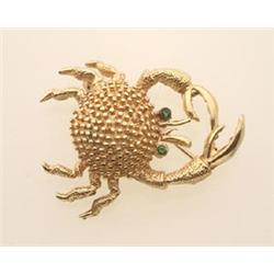 figural crab brooch, in gold In 14K yellow gold, the stylized and textured crab-form brooch has r...