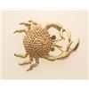 Image 1 : figural crab brooch, in gold In 14K yellow gold, the stylized and textured crab-form brooch has r...