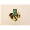 Image 1 : emerald and gold ring The custom made ring in 18K yellow gold features an emerald cut emerald wei...