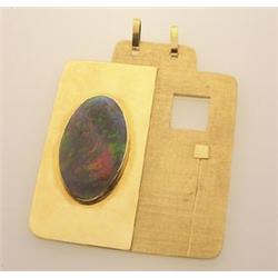 an unusual opal and gold amulet Signed H.B.P., the hand made rectangular plaque of polished and f...