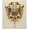Image 1 : gold, diamond and gemstone figural pendant In 18K yellow gold, a stylized double headed bird pend...