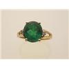 Image 1 : emerald, diamond and gold ring In 18K yellow gold, the four claw settings atop a split shouldered...