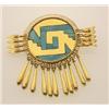 Image 1 : unusual gold and turquoise inlay brooch In 18K yellow gold, the Aztec inspired design is of a wir...