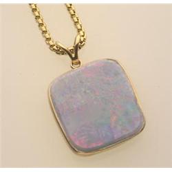 gold and opal doublet pendant and chain The custom made pendant is in 14K yellow gold and is a be...