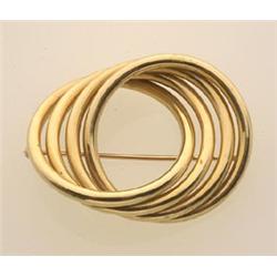 gold circle brooch The brooch is designed as four tubular interlocking rings, in 14K polished yel...