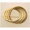Image 1 : gold circle brooch The brooch is designed as four tubular interlocking rings, in 14K polished yel...
