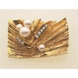 vintage gold, pearl and diamond brooch The 14K yellow gold brooch is an abstract design within a...