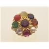 Image 1 : gold and gemstone ring In 18K yellow gold, a round top has a chased star shape design and is set...