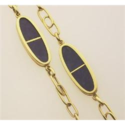 gold and lapis lazuli necklace In 18K yellow gold, six oval stations each with two conforming lap...