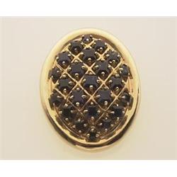 gold and sapphire brooch/pendant The 14K yellow gold brooch is designed as an oval polished bezel...