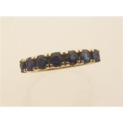 sapphire and gold band style ring In 14K yellow gold, seven round facetted blue sapphires totalli...
