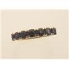 Image 1 : sapphire and gold band style ring In 14K yellow gold, seven round facetted blue sapphires totalli...