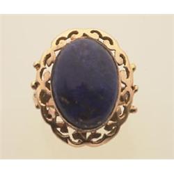 lapis lazuli and gold ring In approximately 18K rose gold, a pierced scalloped edge frame surroun...