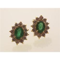 emerald and diamond cluster earrings In 14K yellow gold, with posts for pierced ears, the traditi...