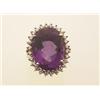 Image 1 : amethyst and diamond cluster ring In 14K yellow and white gold, an oval facetted amethyst weighin...