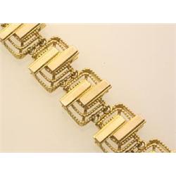 fancy link gold bracelet In 18K yellow gold, the links are designed as two offset white gold topp...