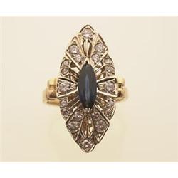 art deco style sapphire and diamond ring In 14K yellow and white gold, a marquise cut .60 carat b...