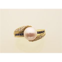 cultured pearl, sapphire and diamond ring The 18K yellow gold wrap around design has twenty-four...
