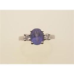tanzanite and diamond ring The ring centers an oval facetted tanzanite weighing 2.04 carats, flan...
