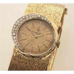 lady's vintage baume & Mercier bangle wristwatch The 14K yellow gold squared hinged bangle has a...