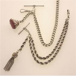 two silver fob chains First, a curb link chain with bar and swivel, is hallmarked Birmingham 1975...
