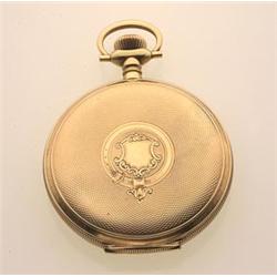 Waltham pocket watch, gold case The 14K yellow gold hunter case with engine turned detail contain...