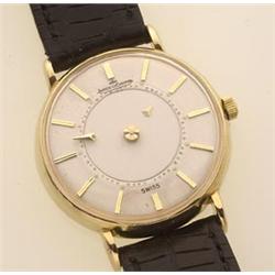 gentleman's jaeger le coultre mystery dial wristwatch With a round gold case, the white dial has...