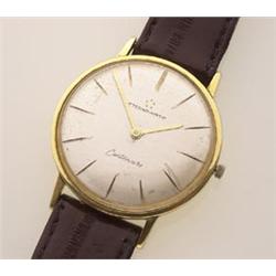 gentleman's eterna-matic centenaire wristwatch The watch has an 18K gold round case, a silvered d...