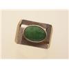 Image 1 : gentleman's gold and jadeite ring In 14K yellow and white gold, the Florentine textured ring is s...