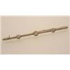 Image 1 : antique bar pin In white topped 18K yellow gold, the straight line bar pin with millegrain detail...