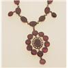 Image 1 : early Victorian garnet and seed pearl necklace The necklace is comprised of a chain of thirty-nin...