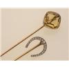 Image 1 : two antique stickpins First, an 18K yellow gold shaft supports a platinum horseshoe set with twen...