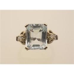 aquamarine and diamond ring A 14K white gold setting with decorative shoulders centers an octagon...