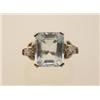Image 1 : aquamarine and diamond ring A 14K white gold setting with decorative shoulders centers an octagon...