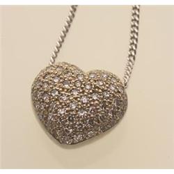 heart shape pendant with pave set diamonds A puffed heart shape pendant is pave set with sixty...