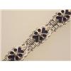 Image 1 : gold, enamel and diamond bracelet In 18K white gold, the ribbed openwork flower motif links have...