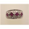 Image 1 : ruby and diamond band style ring The wide domed 18K white gold band is set with four square cut r...