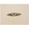 Image 1 : vintage diamond ring In 14K yellow and white gold, a .27 carat round brilliant cut diamond is set...