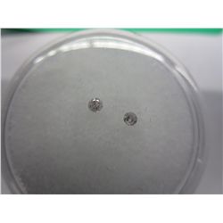 Two loose round cut Diamonds