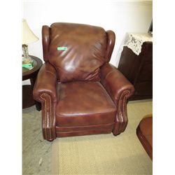 Leather recliner with hobnail detailing.