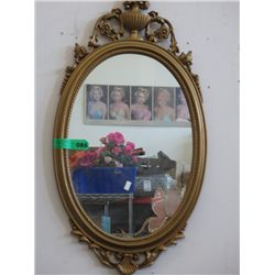 Oval framed mirror. 16" wide x 31" tall