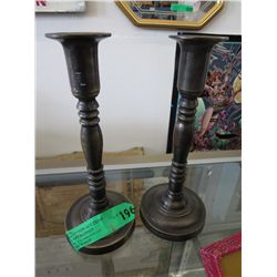 Two candle sticks. 9" tall, 4" dia. at base