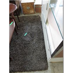 Brown shag area carpet - used