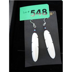 Pair of carved feather style earrings