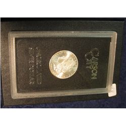 1592. 1884 CC Morgan Silver Dollar in original black box of issue with official card. MS 64/65.