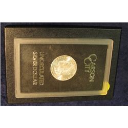 1593. 1884 CC Morgan Silver Dollar in original black box of issue with official card. MS 63-64.