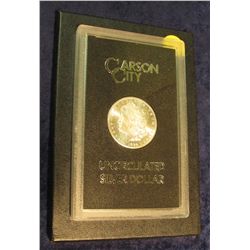 1594. 1884 CC Morgan Silver Dollar in original black box of issue with official card. MS 63/65. Semi
