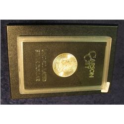 1595. 1884 CC Morgan Silver Dollar in original black box of issue with official card. MS 63.